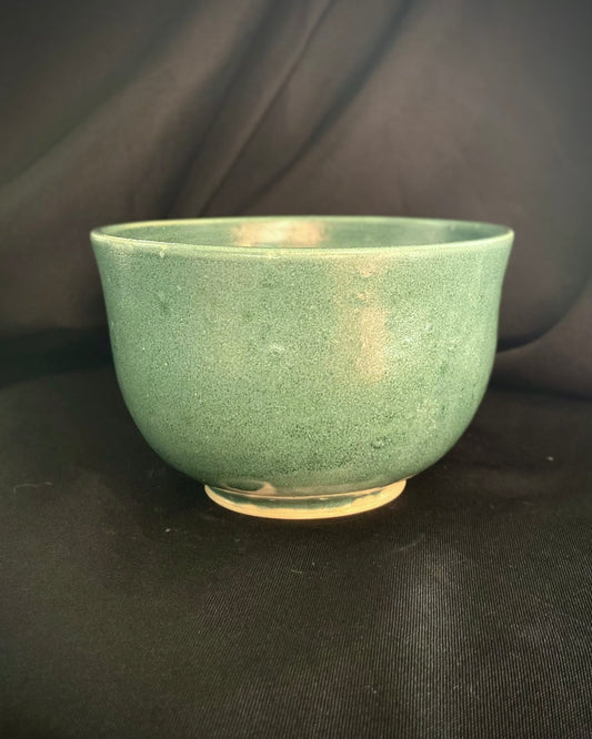 blue satin glaze ramen ceramic bowl, deep ocean bubbles accent the surface, it is wabi sabi.