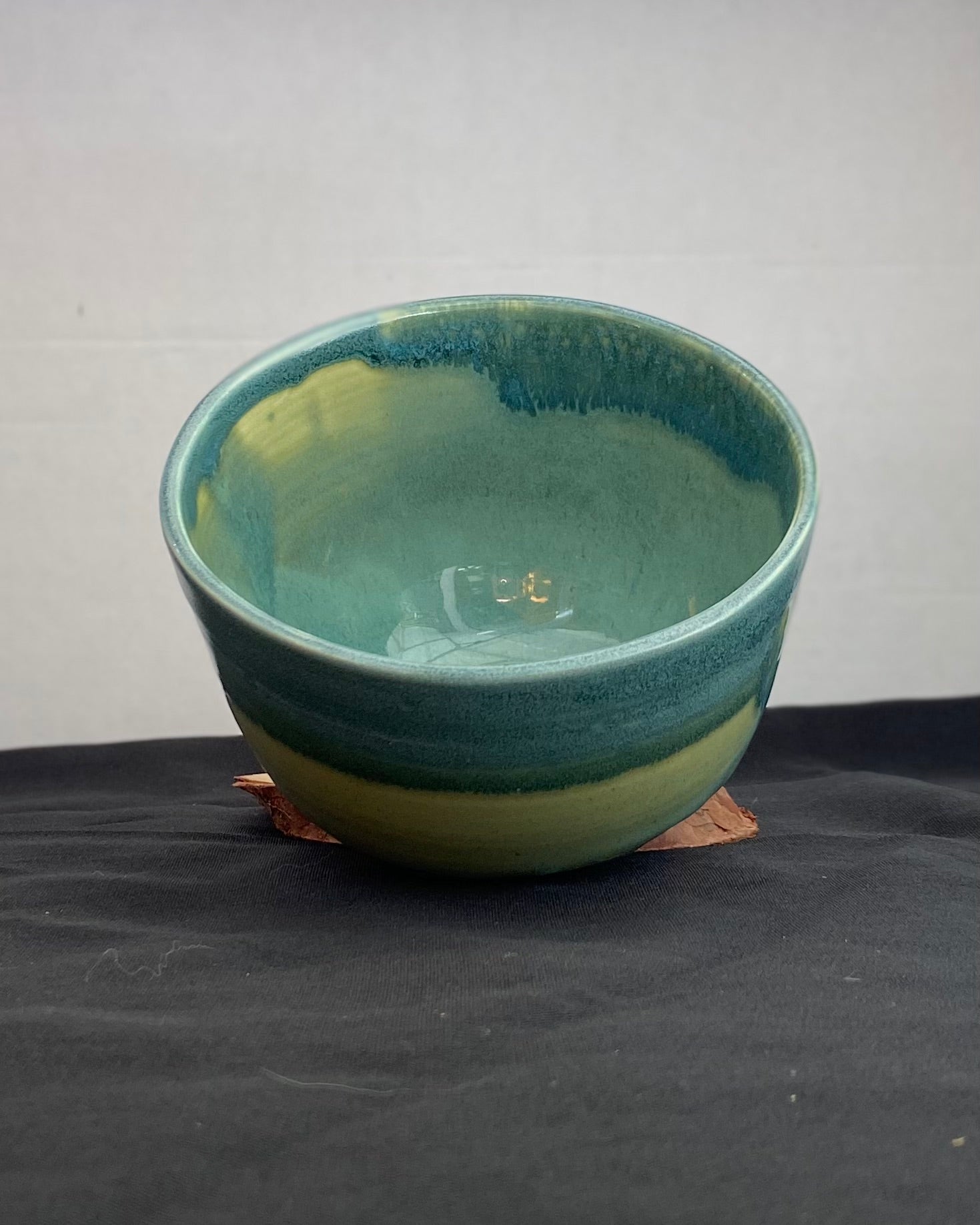 Handmade ceramic ocean bowl with hand-carved ripple texture, and antique blue satin and celadon froth gloss glaze