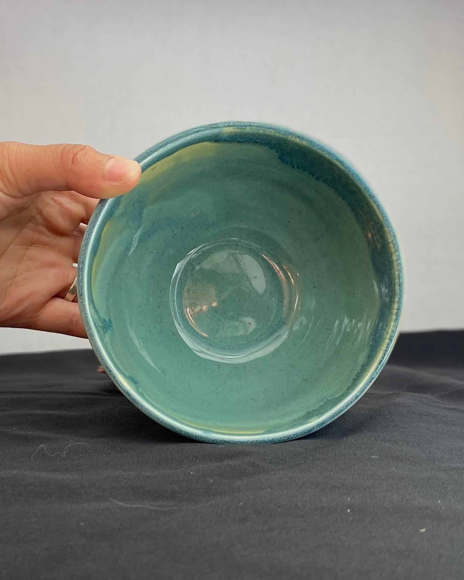 Handmade ceramic ocean bowl with hand-carved ripple texture, and antique blue satin and celadon froth gloss glaze