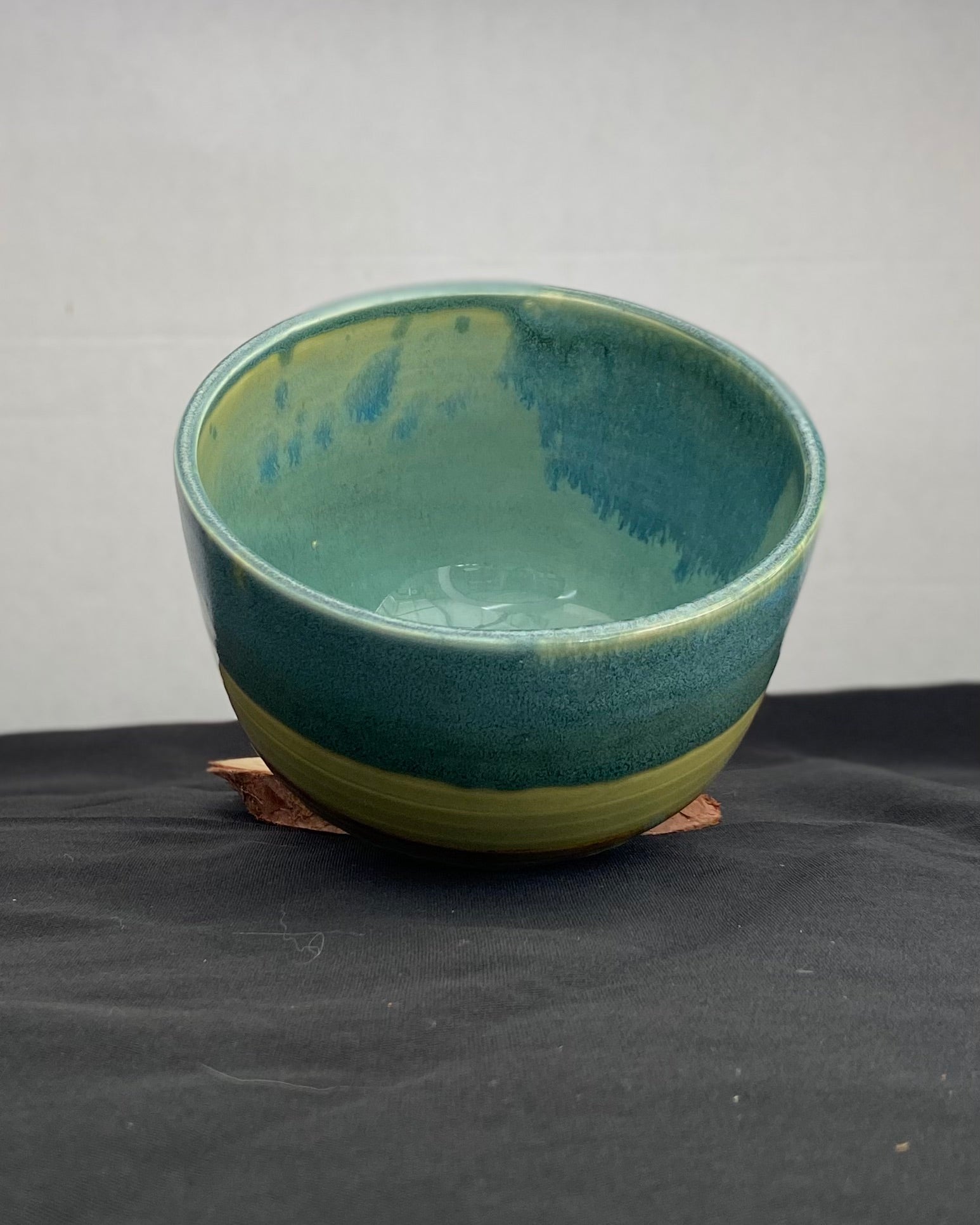 Handmade ceramic ocean bowl with hand-carved ripple texture, and antique blue satin and celadon froth gloss glaze