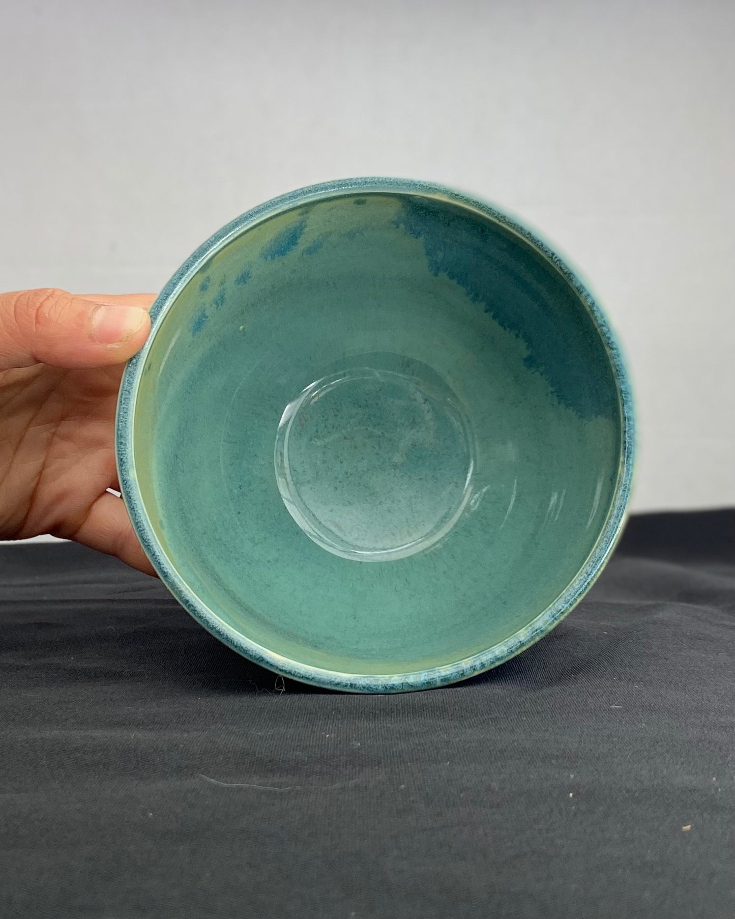 Handmade ceramic ocean bowl with hand-carved ripple texture, and antique blue satin and celadon froth gloss glaze