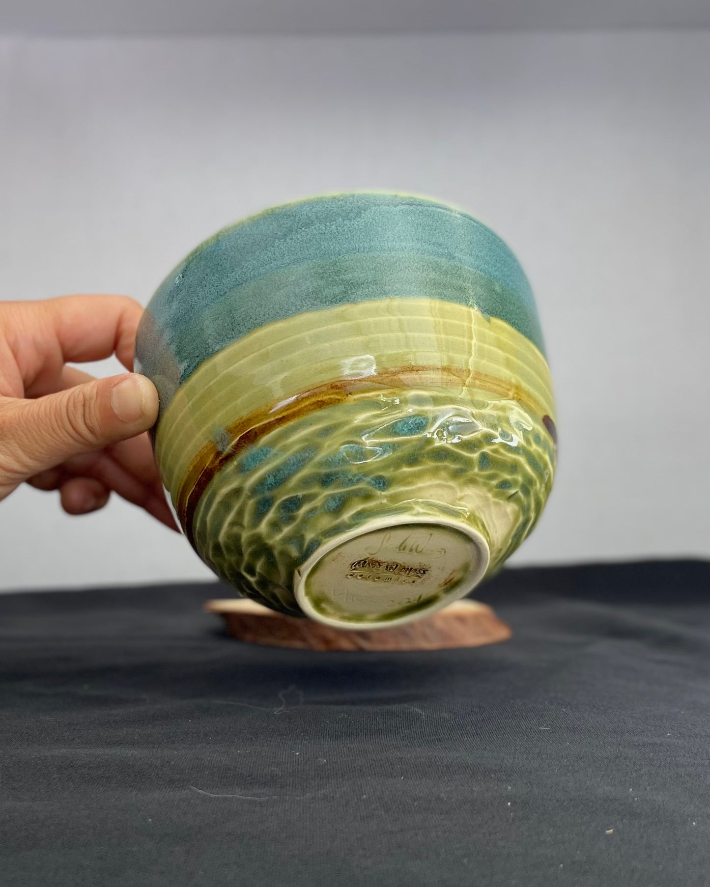 Handmade ceramic ocean bowl with hand-carved ripple texture, and antique blue satin and celadon froth gloss glaze