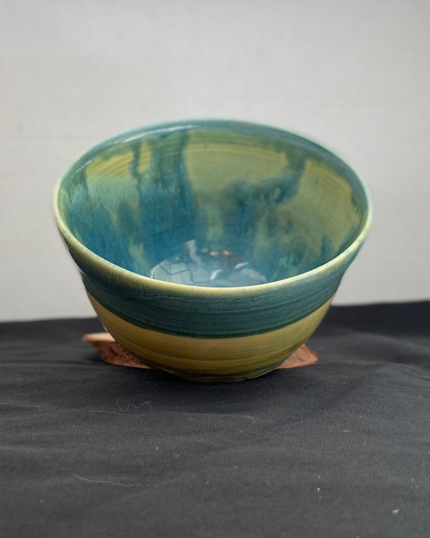 Handmade ceramic ocean bowl with hand-carved ripple texture, and antique blue satin and celadon froth gloss glaze