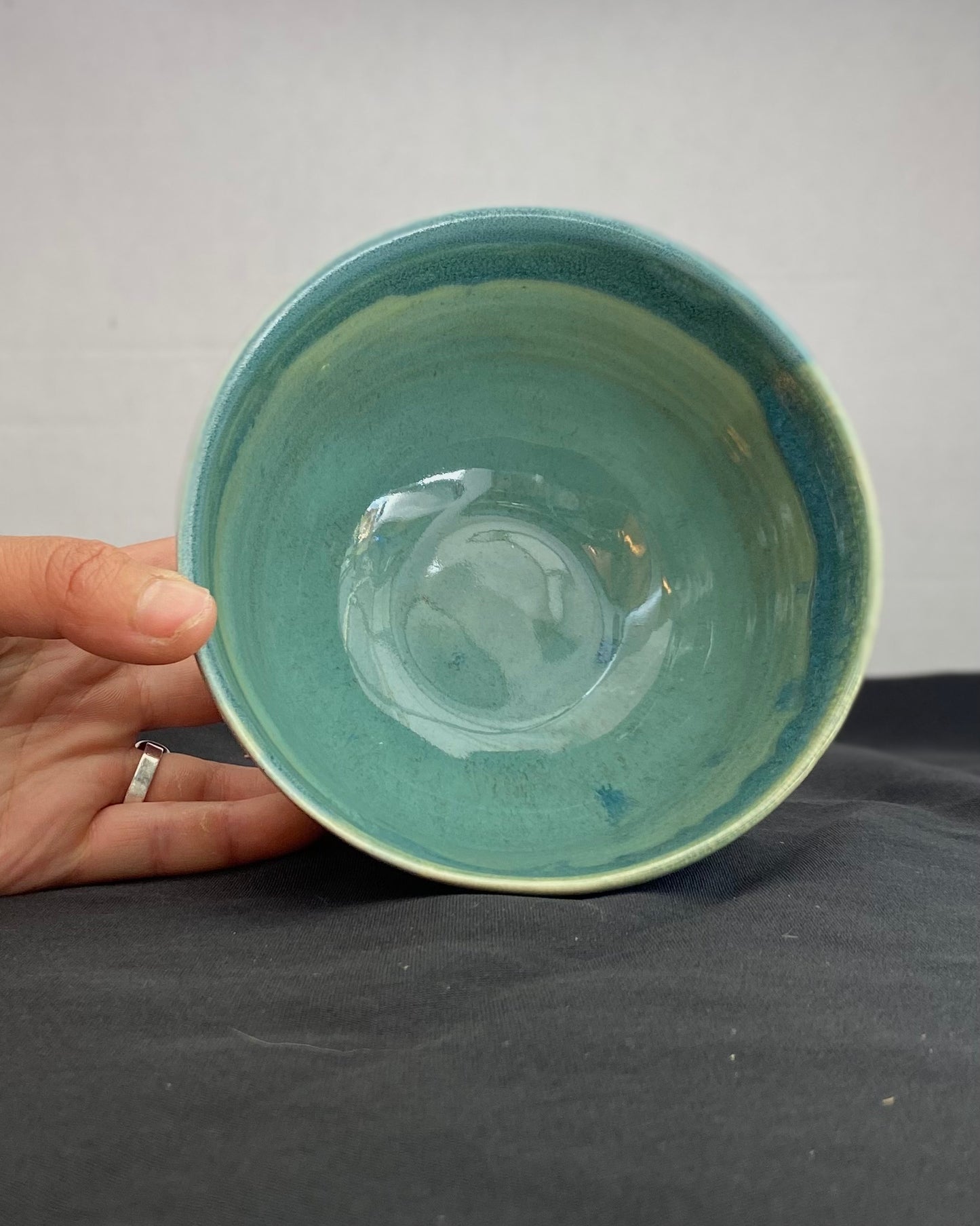 Handmade ceramic ocean bowl with hand-carved ripple texture, and antique blue satin and celadon froth gloss glaze