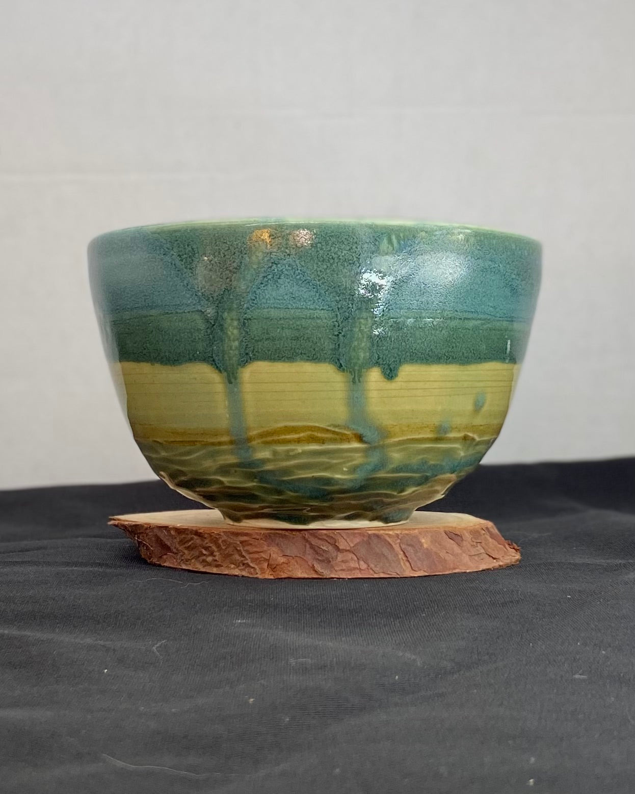 Handmade ceramic ocean bowl with hand-carved ripple texture, and antique blue satin and celadon froth gloss glaze