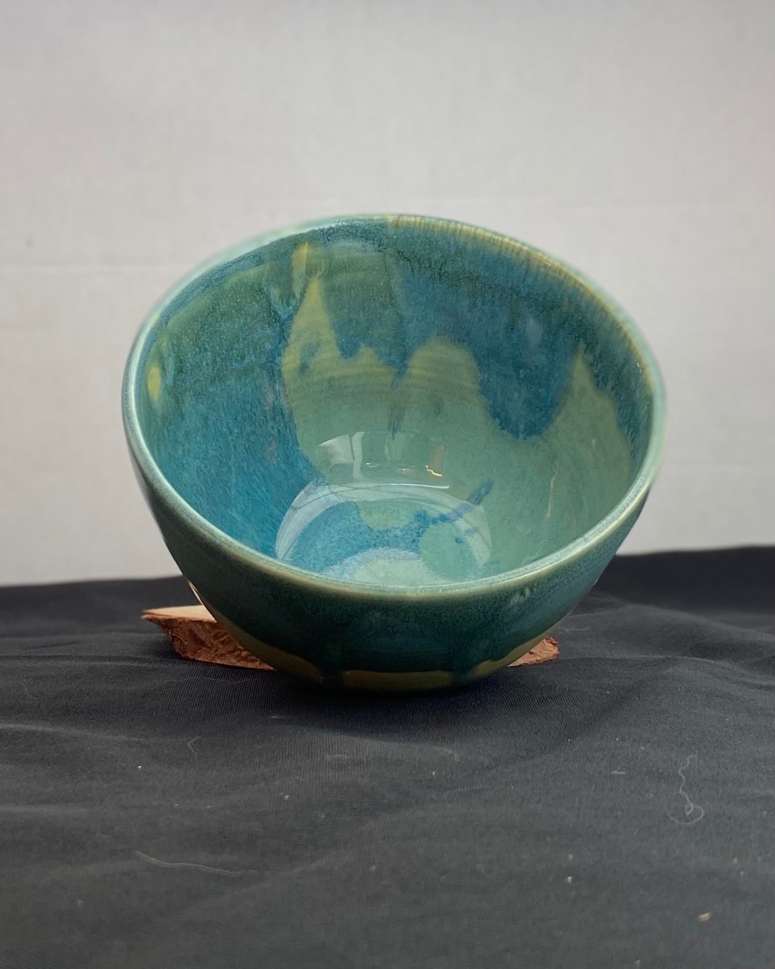 Handmade ceramic ocean bowl with hand-carved ripple texture, and antique blue satin and celadon froth gloss glaze