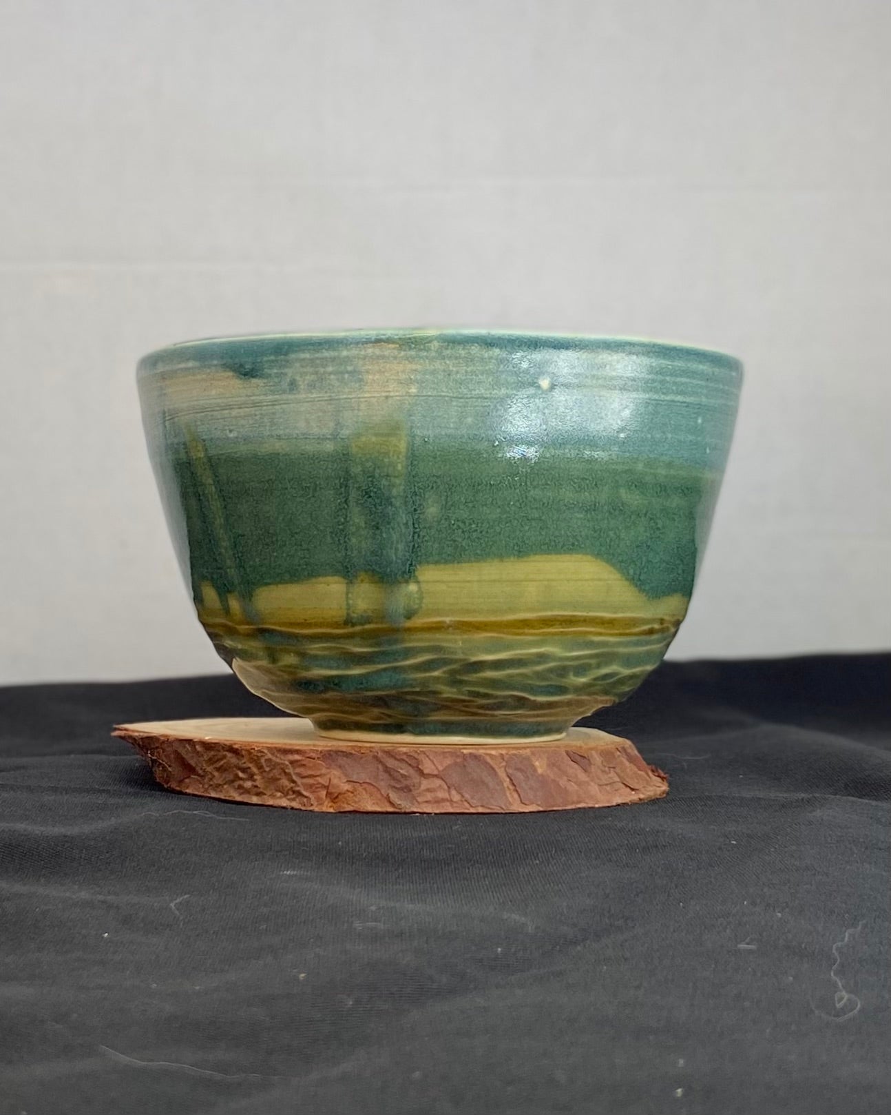 Handmade ceramic ocean bowl with hand-carved ripple texture, and antique blue satin and celadon froth gloss glaze