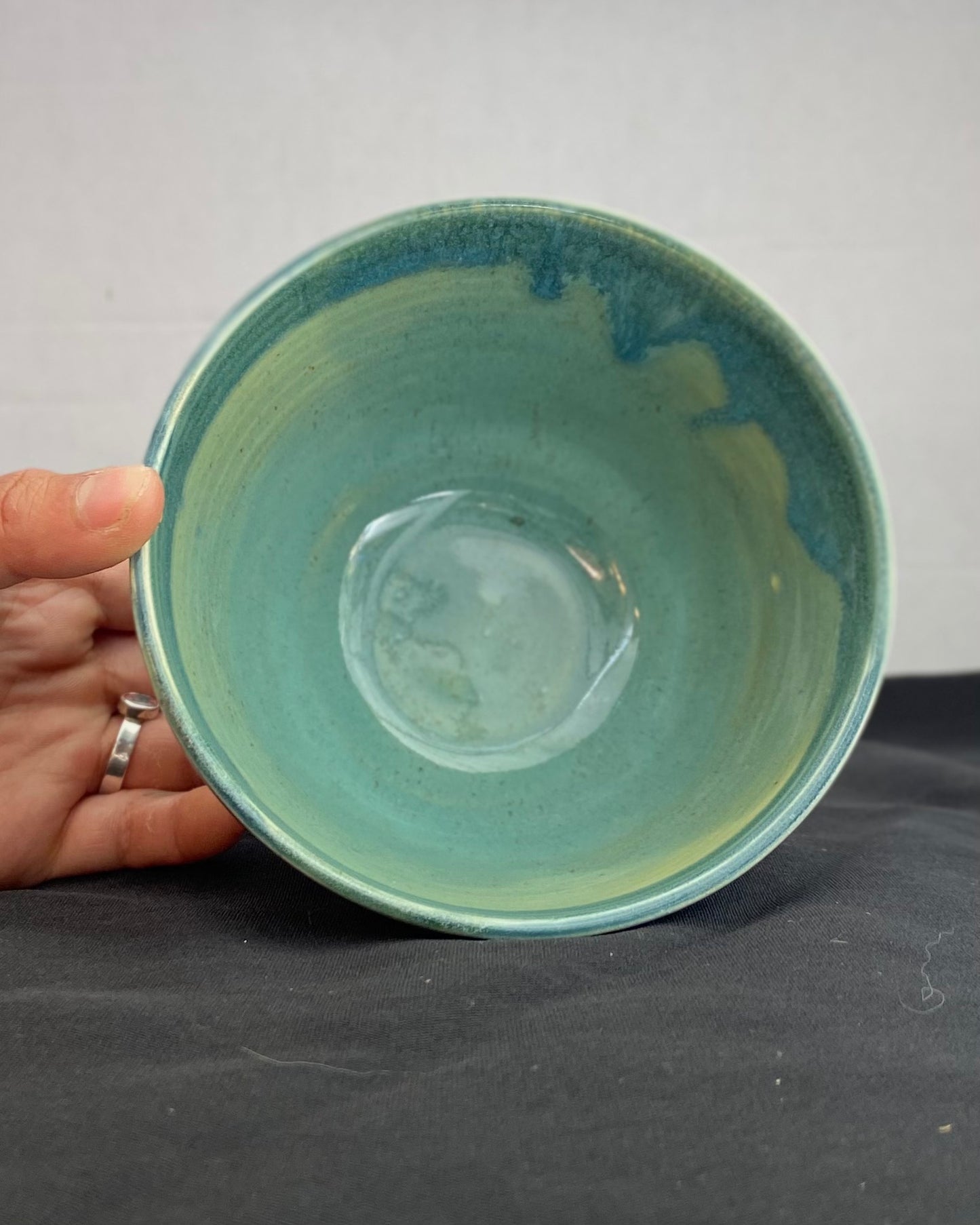 Handmade ceramic ocean bowl with hand-carved ripple texture, and antique blue satin and celadon froth gloss glaze