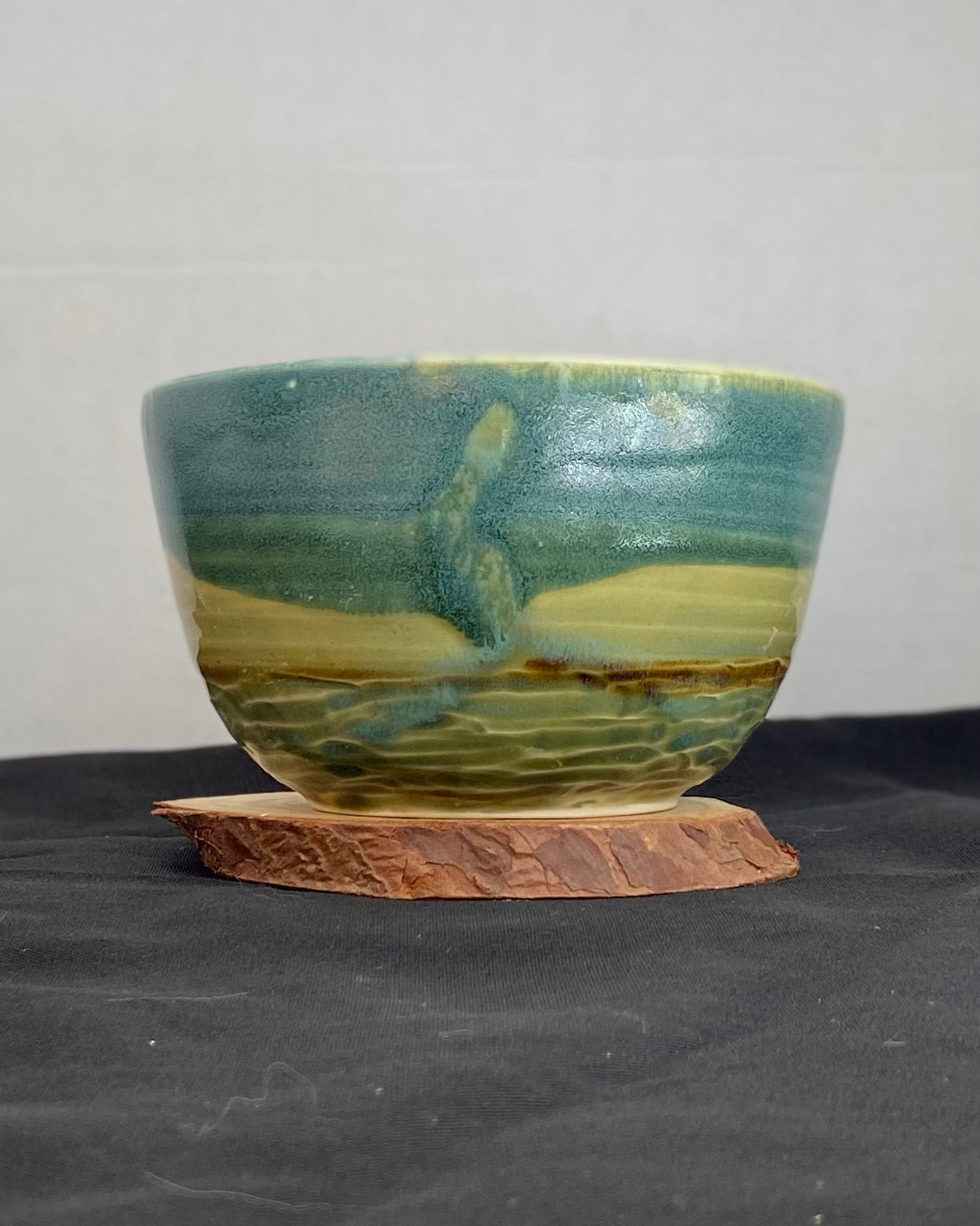 Handmade ceramic ocean bowl with hand-carved ripple texture, and antique blue satin and celadon froth gloss glaze