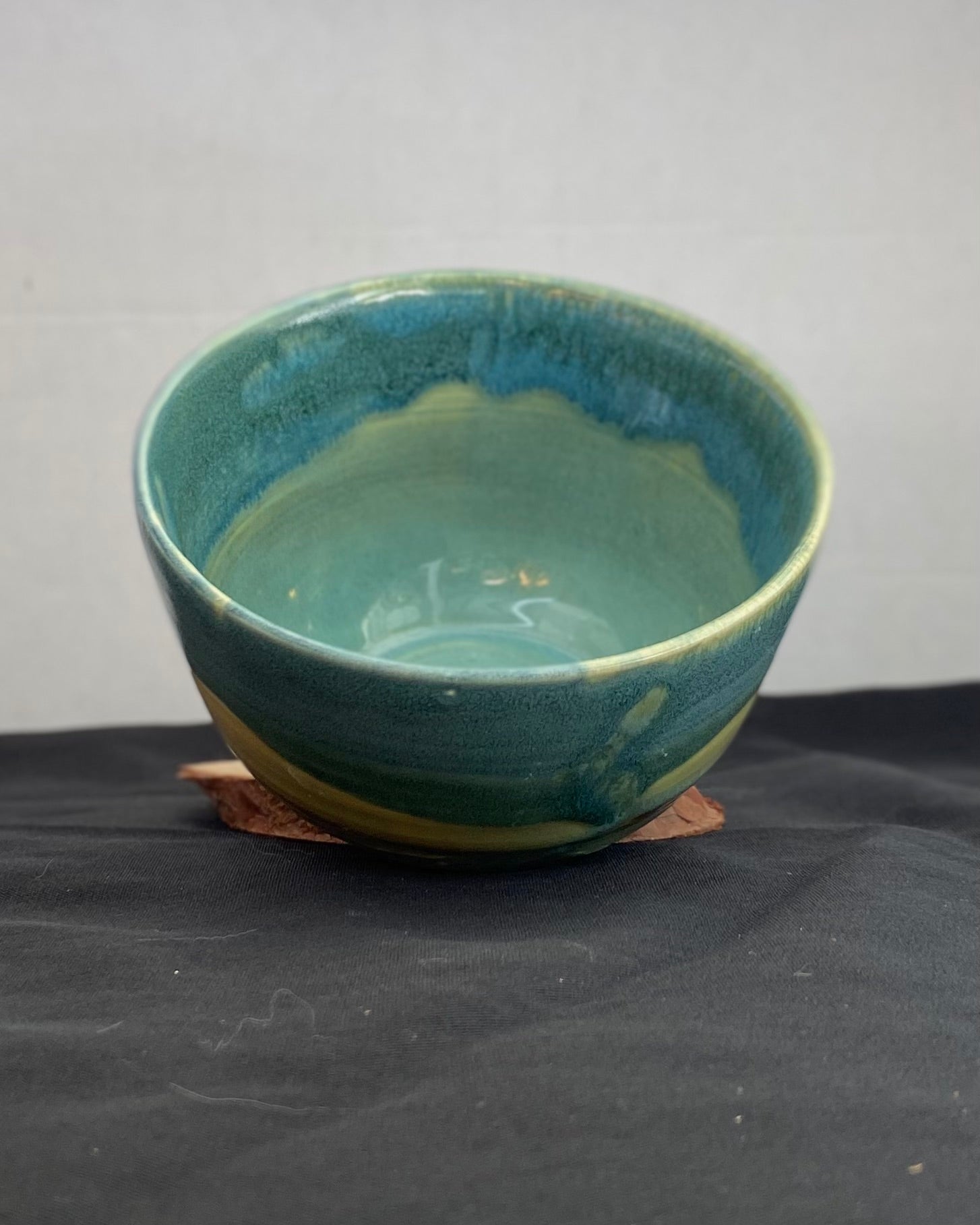 Handmade ceramic ocean bowl with hand-carved ripple texture, and antique blue satin and celadon froth gloss glaze