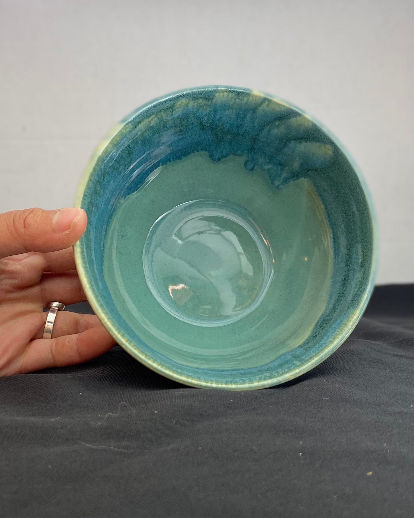 Handmade ceramic ocean bowl with hand-carved ripple texture, and antique blue satin and celadon froth gloss glaze