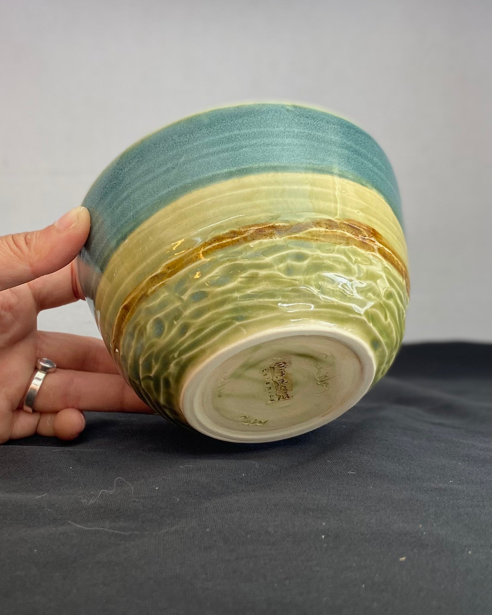 Handmade ceramic ocean bowl with hand-carved ripple texture, and antique blue satin and celadon froth gloss glaze