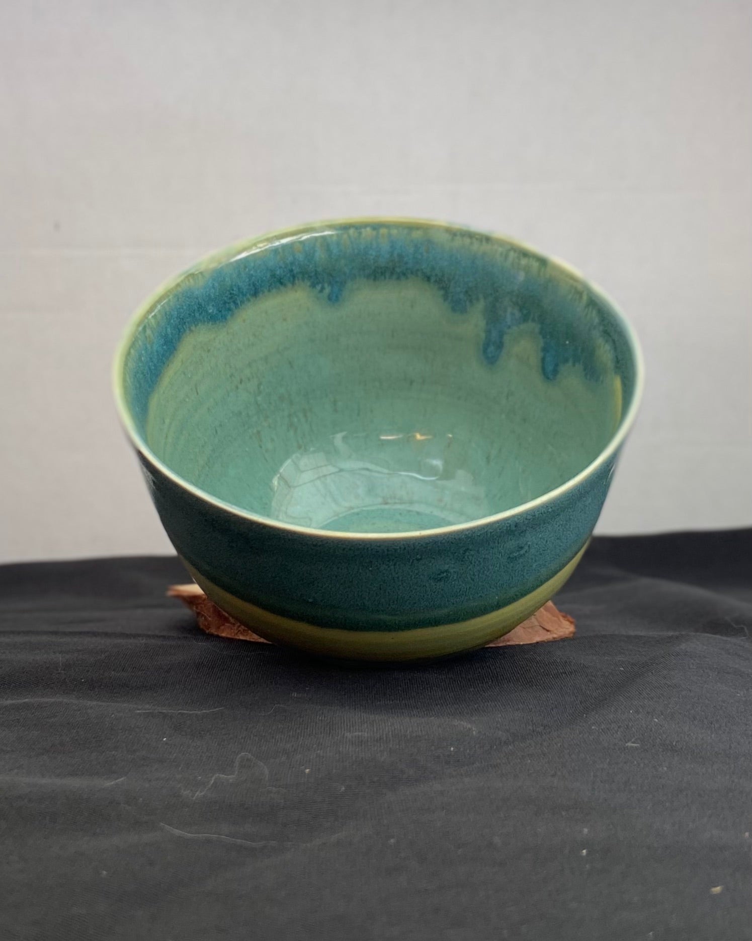 Handmade ceramic ocean bowl with hand-carved ripple texture, and antique blue satin and celadon froth gloss glaze