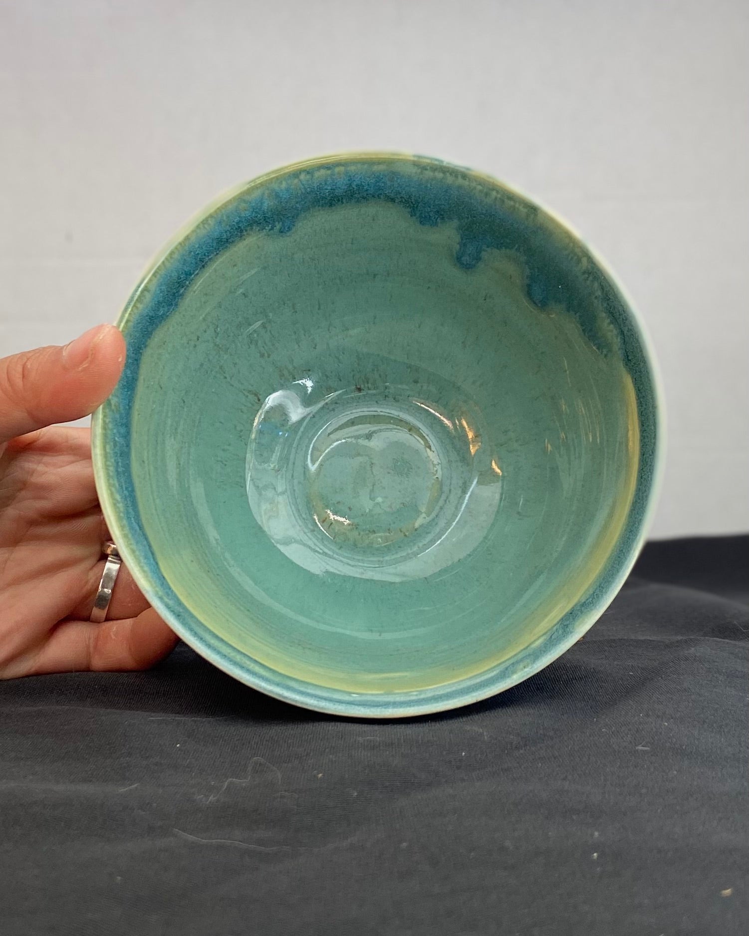 Handmade ceramic ocean bowl with hand-carved ripple texture, and antique blue satin and celadon froth gloss glaze