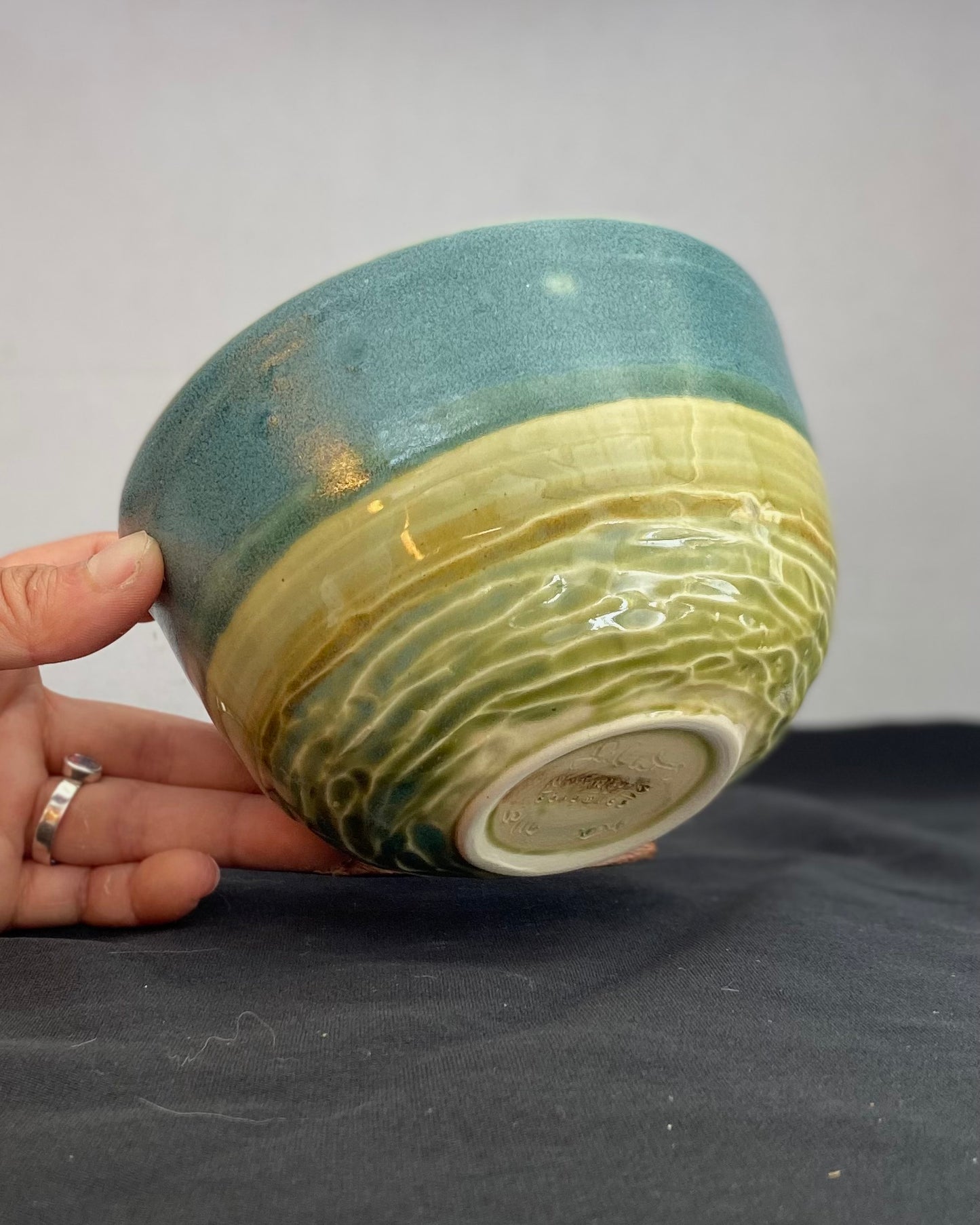 Handmade ceramic ocean bowl with hand-carved ripple texture, and antique blue satin and celadon froth gloss glaze