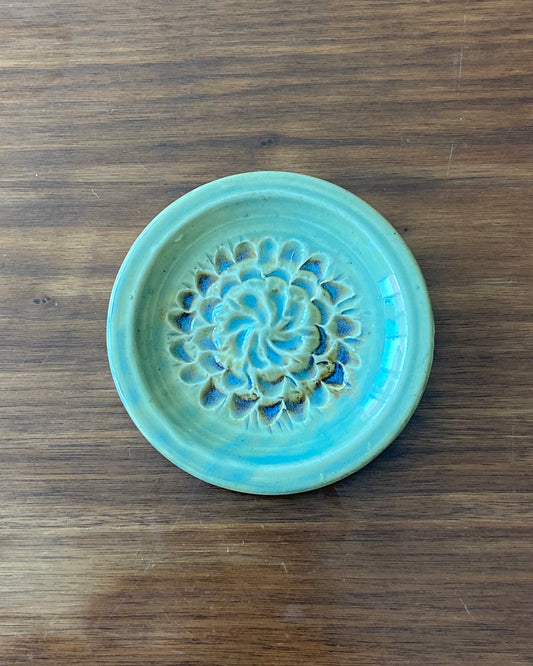 hand crafted, hand carved flower dish, celadon blue glaze with iron oxide accent.